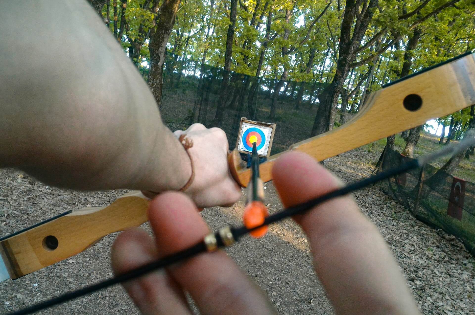 Archer shooting traditional bow