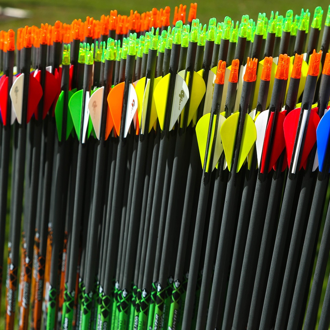 colorful archery arrows stacked next to each other