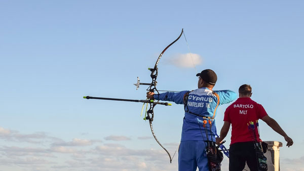 a pro firing a competition bow
