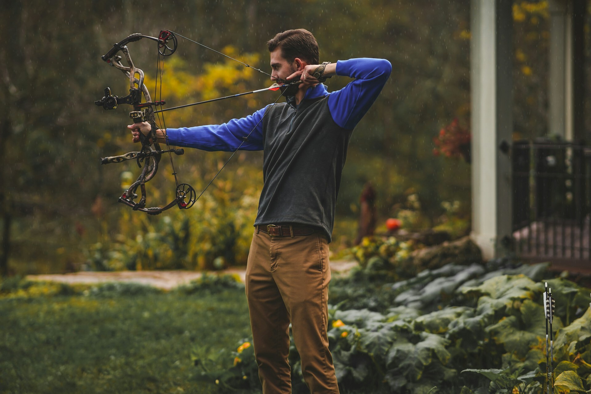Archer shooting a bow with string silencers