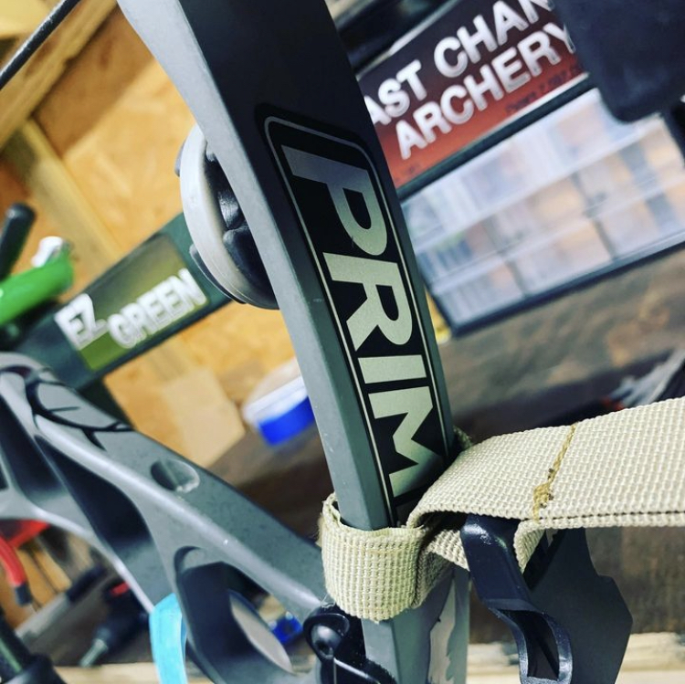 Last Chance archery EZ green bow press in a home archery shop