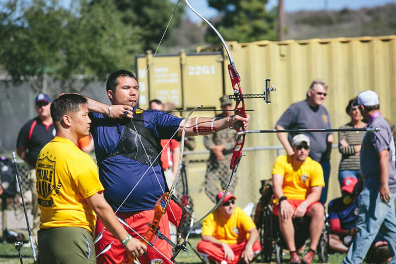 man aiming the target in archery 